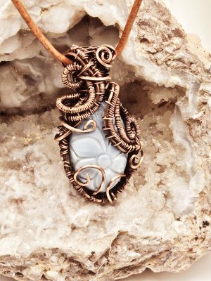 Carved Larimar stone wrapped in oxidized copper